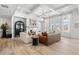 Elegant living room featuring coffered ceilings, hardwood floors, and large windows at 5120 Token Chase, Cumming, GA 30040