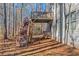 Lovely elevated back deck with stairs cascading down to ground level provides seamless outdoor enjoyment at 205 Bergen Dr, Fayetteville, GA 30215