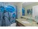 Charming bathroom featuring granite countertop, a flower curtain, and a well-lit mirror at 205 Bergen Dr, Fayetteville, GA 30215