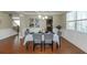 Formal dining room with hardwood floors, wainscoting, and elegant chandelier at 205 Bergen Dr, Fayetteville, GA 30215