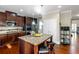 Modern kitchen featuring granite island, stainless steel appliances, and ample cabinet space at 205 Bergen Dr, Fayetteville, GA 30215