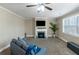 Cozy living room showcases a fireplace, plush carpet, and lots of bright light at 205 Bergen Dr, Fayetteville, GA 30215