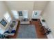 View of the living room shows hardwood floors, neutral paint, and an abundance of bright light at 205 Bergen Dr, Fayetteville, GA 30215