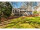 Backyard view of two-story home with deck and screened-in porch at 2733 Eagle Ridge Rd, Marietta, GA 30062