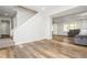 Finished basement featuring wood-look flooring, light gray walls, stairs, and a cozy sectional sofa at 2733 Eagle Ridge Rd, Marietta, GA 30062