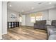 Finished basement featuring wood-look flooring, light gray walls, and a comfortable gray sectional sofa at 2733 Eagle Ridge Rd, Marietta, GA 30062