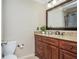 Half bathroom featuring dark wood vanity with granite counters, sink, and modern finishes at 2733 Eagle Ridge Rd, Marietta, GA 30062