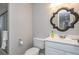 Bathroom with white vanity, mirror, and shower with glass door at 2733 Eagle Ridge Rd, Marietta, GA 30062