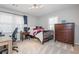 Bedroom with a single bed, a nightstand, large dresser and bright windows at 2733 Eagle Ridge Rd, Marietta, GA 30062