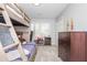 Bedroom featuring a wooden bunkbed, dresser, carpet and window with natural light at 2733 Eagle Ridge Rd, Marietta, GA 30062