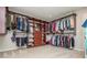 Spacious walk-in closet with custom wood shelving and organization for clothing and accessories at 2733 Eagle Ridge Rd, Marietta, GA 30062