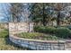 Stone sign for Chimney Springs surrounded by flowers and greenery at 2733 Eagle Ridge Rd, Marietta, GA 30062