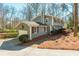 Well-maintained home featuring an attached garage and a side yard with mature trees at 2733 Eagle Ridge Rd, Marietta, GA 30062