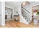 Beautiful foyer showcasing hardwood floors, staircase, and seamless transition into the kitchen and living areas at 2733 Eagle Ridge Rd, Marietta, GA 30062