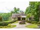 Charming home with a circular driveway and lush landscaping at 2733 Eagle Ridge Rd, Marietta, GA 30062