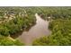 Areal view of lake surrounded by houses and lush green trees at 2733 Eagle Ridge Rd, Marietta, GA 30062