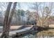 Stone bridge over community pond surrounded by mature trees creates a peaceful scenery at 2733 Eagle Ridge Rd, Marietta, GA 30062