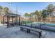 View of tennis courts with gazebo and bench seating creating a relaxing atmosphere near the court at 2733 Eagle Ridge Rd, Marietta, GA 30062