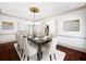 Formal dining room with a chandelier, hardwood floors, and elegant decor at 973 Peachtree Battle Ave, Atlanta, GA 30327