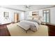 Serene main bedroom with neutral tones, hardwood floors, and ample natural light at 973 Peachtree Battle Ave, Atlanta, GA 30327