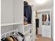 Walk-in closet with custom shelving and plenty of hanging space at 3641 Devenwood Way, Buford, GA 30519