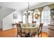 Charming dining area with hardwood floors, chandelier, and seating for four at 3641 Devenwood Way, Buford, GA 30519