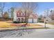 Inviting two-story home featuring red shutters, a covered porch, and an attached two-car garage at 3641 Devenwood Way, Buford, GA 30519