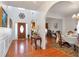 Open foyer featuring hardwood floors, arched doorways, and elegant decor at 3641 Devenwood Way, Buford, GA 30519