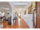 Elegant foyer with hardwood floors, arched doorways, and decorative lighting fixtures at 3641 Devenwood Way, Buford, GA 30519
