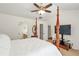 Bedroom featuring a four poster bed, vaulted ceiling, and ample natural light at 3641 Devenwood Way, Buford, GA 30519