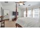 Comfortable bedroom with a four poster bed and large windows at 3641 Devenwood Way, Buford, GA 30519