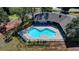 Aerial view of the community pool surrounded by lounge chairs and greenery at 3641 Devenwood Way, Buford, GA 30519