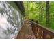 Deck overlooking a forest with outdoor furniture at 1291 Marcelle Heights Pl, Norcross, GA 30093