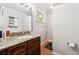 Bathroom featuring granite countertops, a mirror, and a barn door medicine cabinet at 1291 Marcelle Heights Pl, Norcross, GA 30093