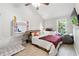 Bedroom with a ceiling fan, a window, and a desk at 1291 Marcelle Heights Pl, Norcross, GA 30093