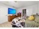 Cozy bedroom showcasing a bed, chest of drawers, a closet, and flat screen television at 1291 Marcelle Heights Pl, Norcross, GA 30093