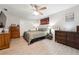 Large bedroom features light wood flooring, ceiling fan, and closet at 1291 Marcelle Heights Pl, Norcross, GA 30093