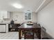 Basement dining area features tile floor, window view, and dining table with seating for six at 1291 Marcelle Heights Pl, Norcross, GA 30093