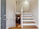 Interior shot of staircase with white risers and wood treads, leading up to the second floor at 1291 Marcelle Heights Pl, Norcross, GA 30093