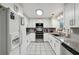 Bright, modern kitchen featuring white cabinets, granite countertops, and stainless steel appliances at 1291 Marcelle Heights Pl, Norcross, GA 30093