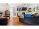 Spacious living room with two sofas, a chair, a ceiling fan, and a large television at 1291 Marcelle Heights Pl, Norcross, GA 30093