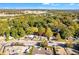 Aerial view of the property, with its buildings, trees, and nearby parking lot at 1640 Lakewood Se Ave, Atlanta, GA 30315