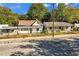 Two modest, single-Gathering homes with fenced yards and mature trees at 1640 Lakewood Se Ave, Atlanta, GA 30315