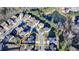 An aerial view reveals a home nestled within a vibrant neighborhood, complete with lush green spaces and serene pond views at 2640 Paddock Point Pl, Dacula, GA 30019
