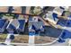 Aerial view of a two-story brick home, showcasing the driveway, well-maintained lawn, and fenced backyard with a playset at 2640 Paddock Point Pl, Dacula, GA 30019