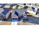 Overhead view of a brick home highlighting the driveway, front yard landscaping, and surrounding neighborhood at 2640 Paddock Point Pl, Dacula, GA 30019