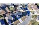 Drone view of a home showcasing the roof, driveway, front lawn, and neighborhood layout at 2640 Paddock Point Pl, Dacula, GA 30019