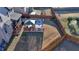 A spacious backyard features a covered patio, a seating area, and a well-maintained lawn, enclosed by a wooden fence at 2640 Paddock Point Pl, Dacula, GA 30019