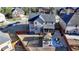 A large backyard with a covered patio, seating area, and a red fence at 2640 Paddock Point Pl, Dacula, GA 30019