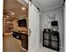Finished basement featuring a sliding barn door and entertainment area with a stone accent wall at 2640 Paddock Point Pl, Dacula, GA 30019
